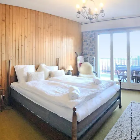 Between Slopes And Golf Facing The Alps